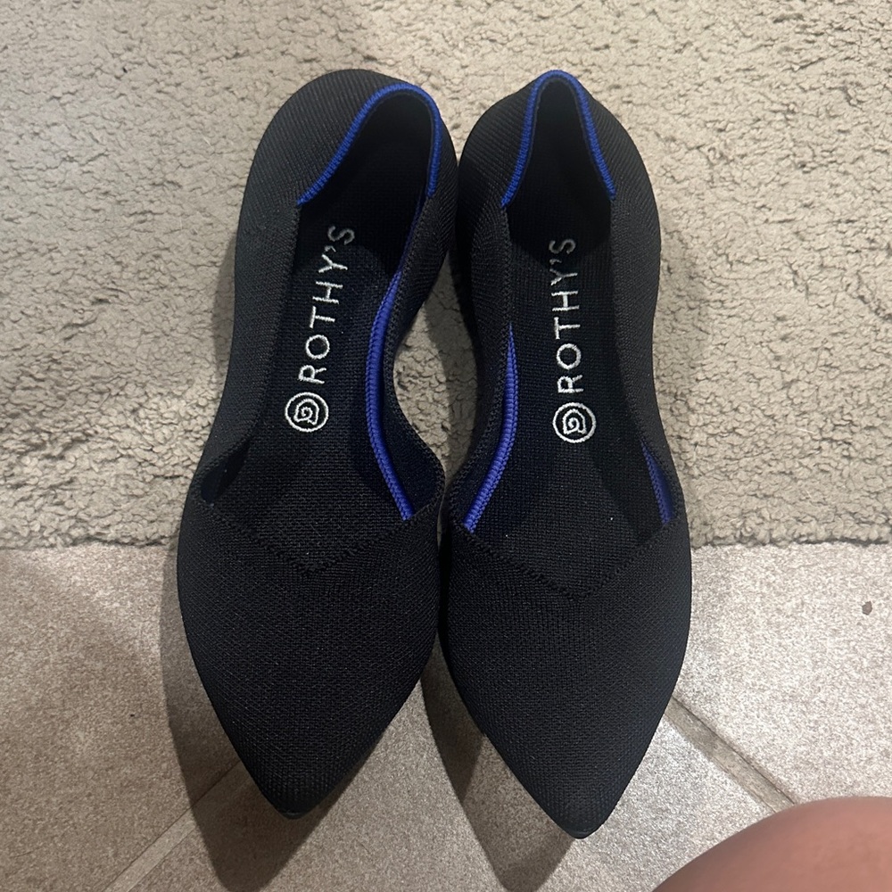 Rothy's Elegant Black Flats with Vibrant Blue Accents